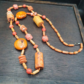 Long Coral Beads Vintage Pink and Orange Coral Beads Necklace. Handcrafted with meticulous care, this statement piece seamlessly blends vintage charm with contemporary allure. Each coral bead exudes natural beauty, showcasing unique patterns and hues, adding a touch of sophistication to any ensemble. Whether paired with a casual outfit or a formal attire, this exquisite necklace elevates your style effortlessly.