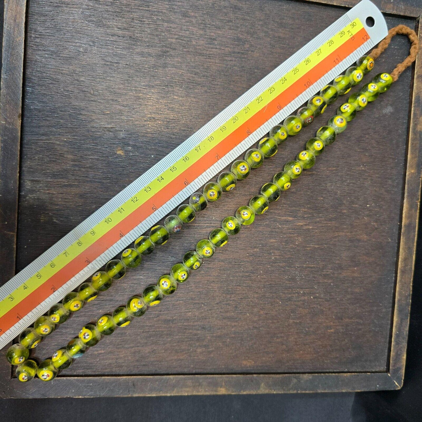 Greenish tint small yellow smiley faces venetian inspired beads strand