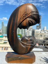 Vintage Mother and Child Hand Carved Wood Sculpture home decorating piece.