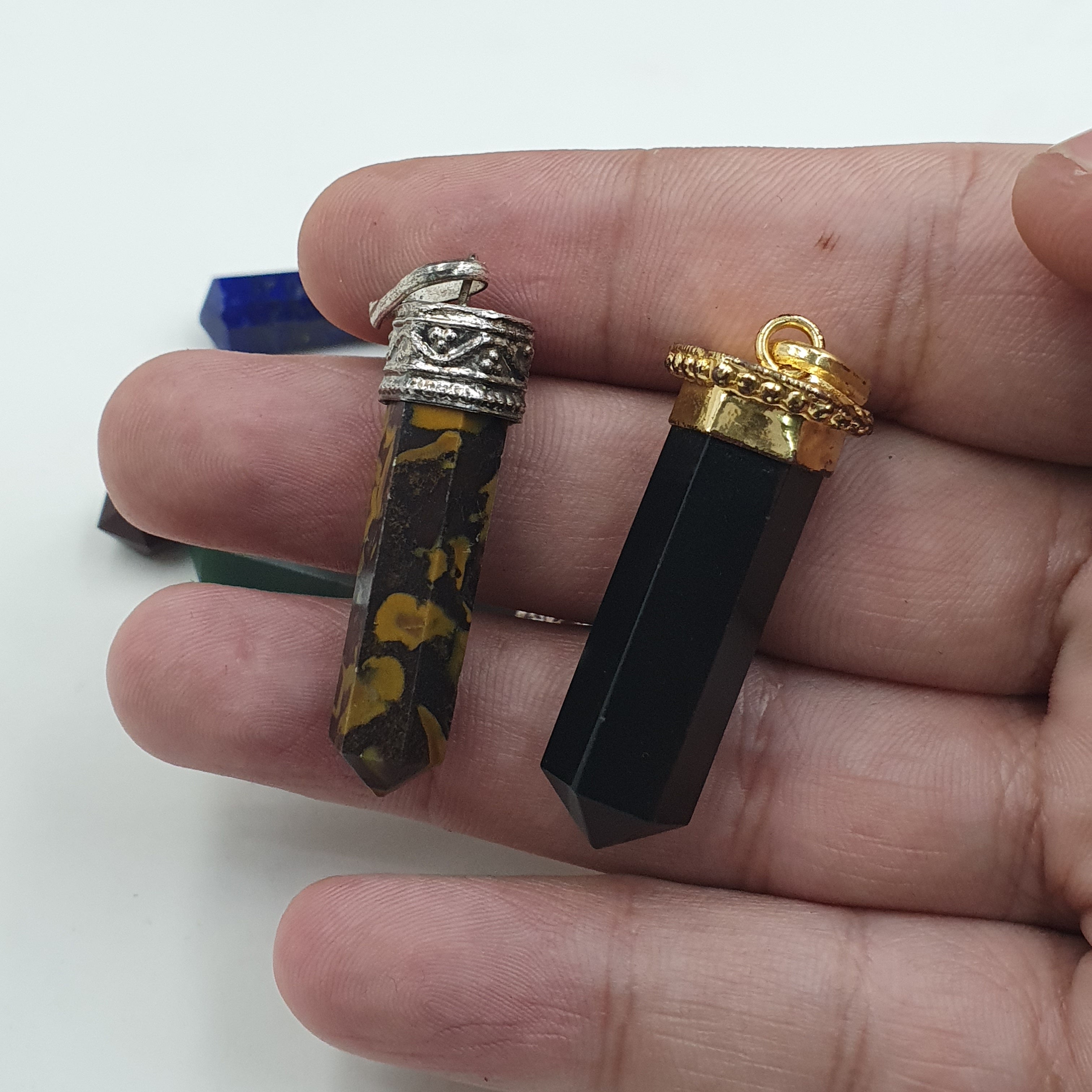 Mix of natural gemstone pendants including agate, jade, jasper, and more