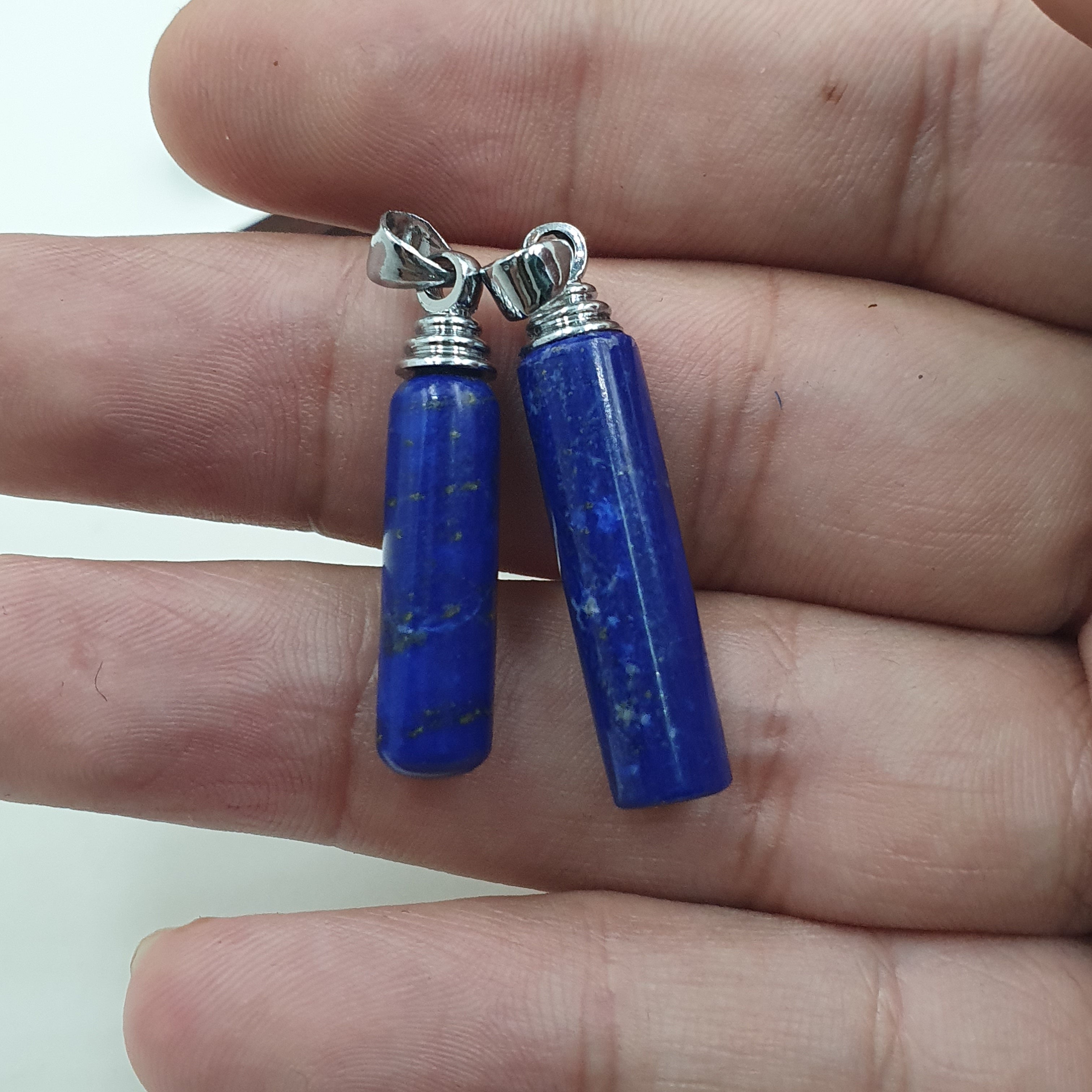 Mix of natural gemstone pendants including agate, jade, jasper, and more