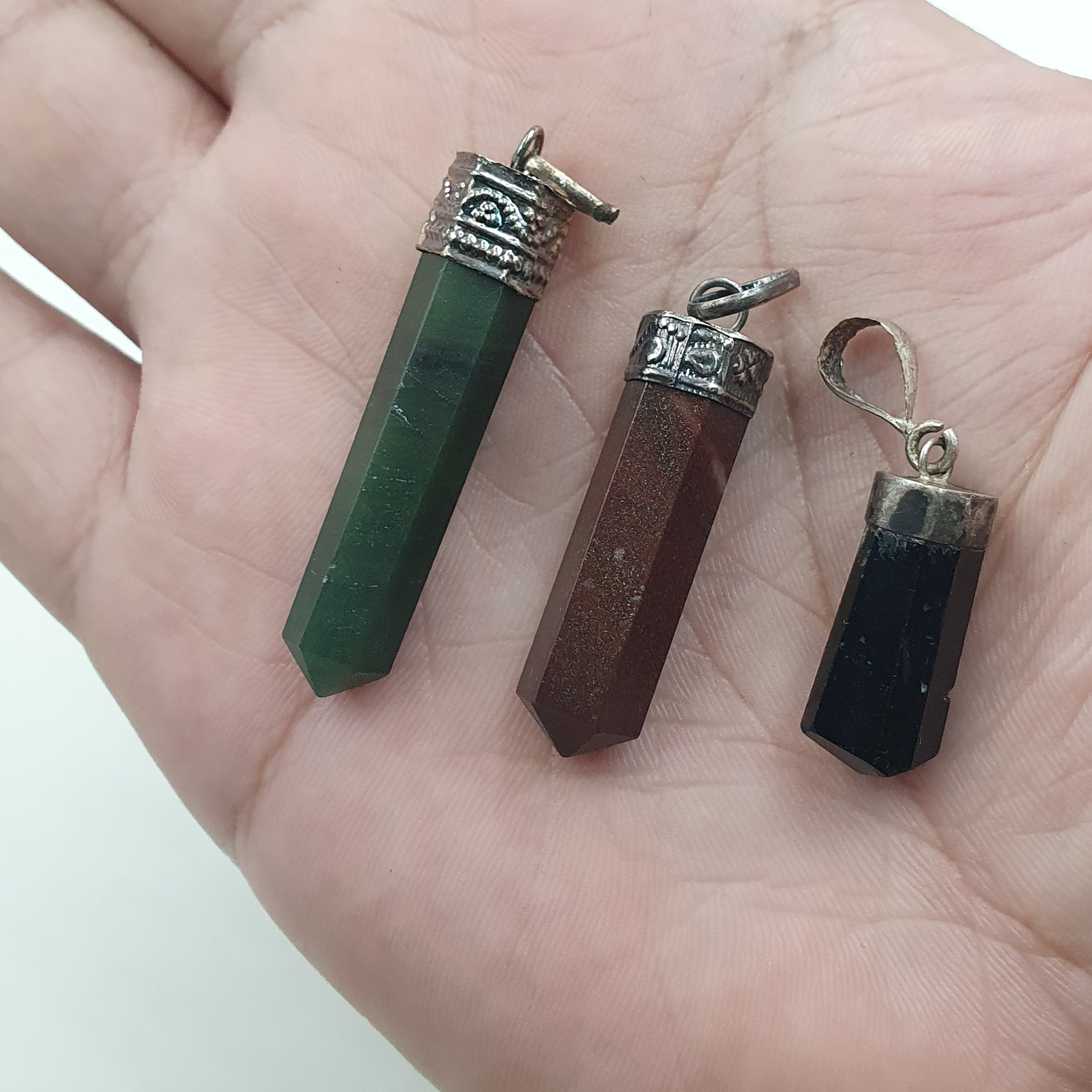 Mix of natural gemstone pendants including agate, jade, jasper, and more