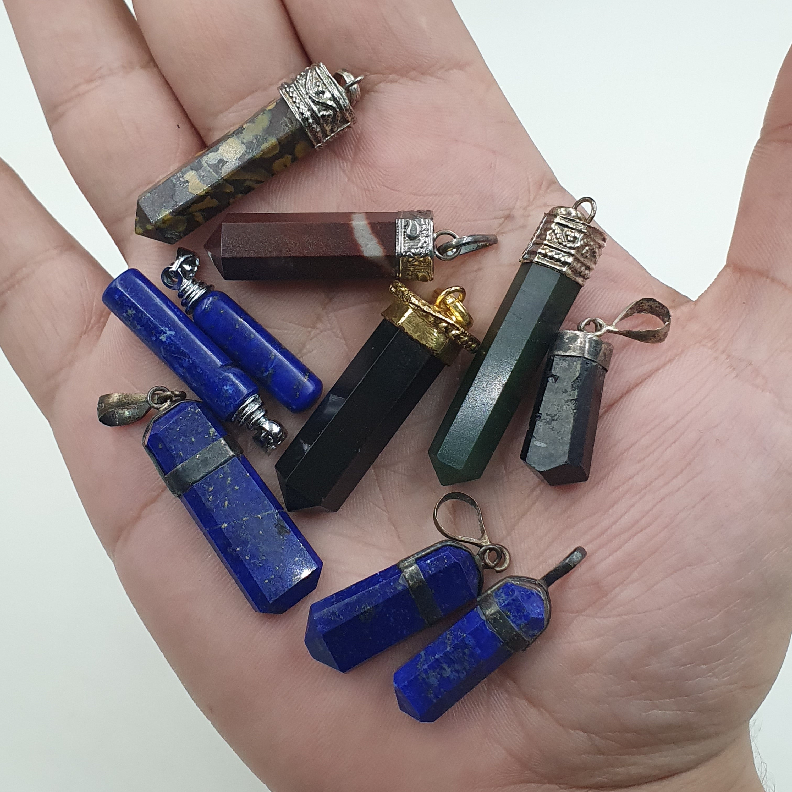 Mix of natural gemstone pendants including agate, jade, jasper, and more