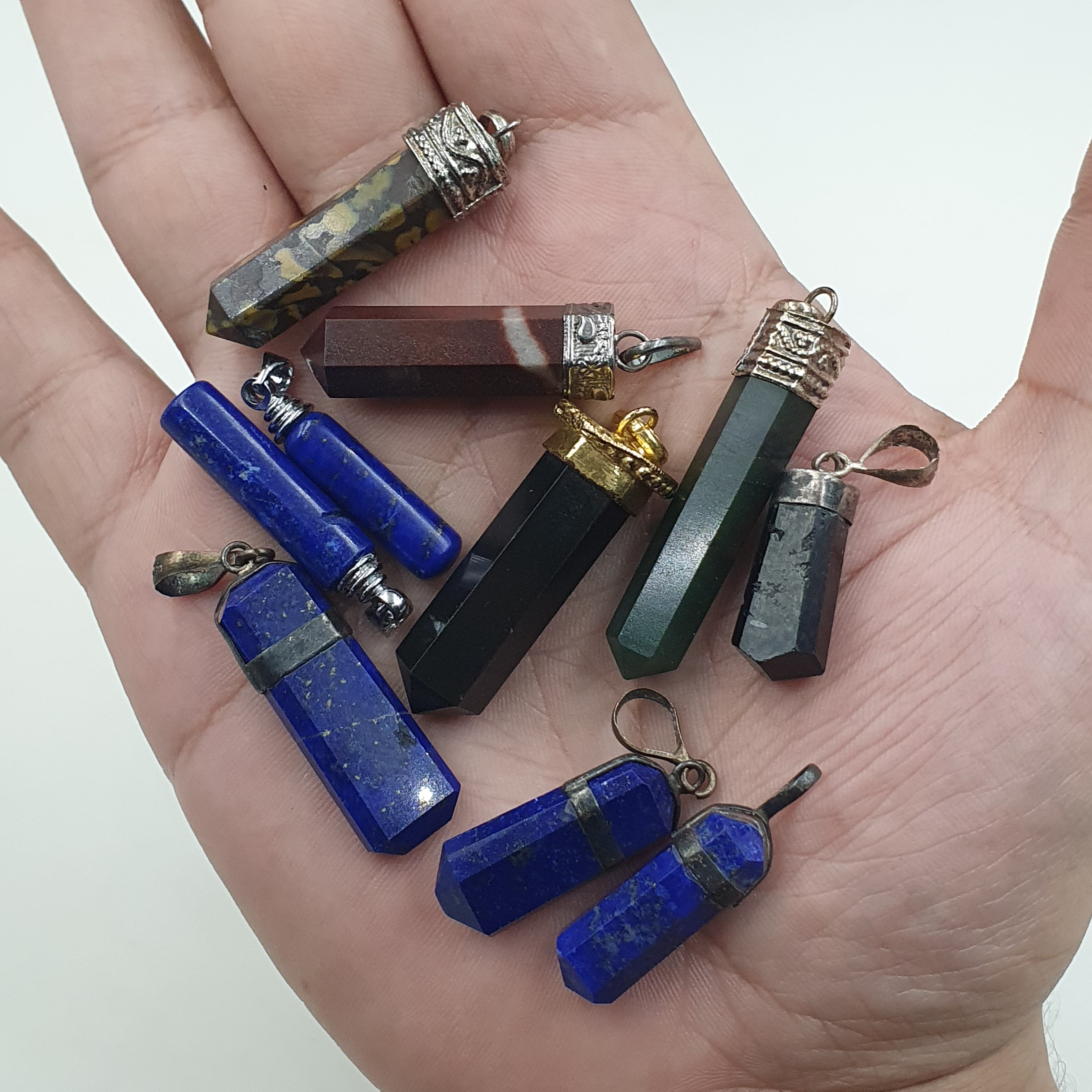 Mix of natural gemstone pendants including agate, jade, jasper, and more