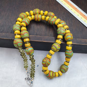 Handmade multicolor beaded necklace laid out for a full view