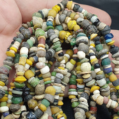 "RM-3: An extraordinary authentic ancient strand necklace from the Islamic Roman Era, featuring six strands of intricately crafted beads. Each bead is a testament to the skill and craftsmanship of ancient artisans, showcasing a rich history and cultural heritage. A true collector's piece, this necklace is a rare and precious find."