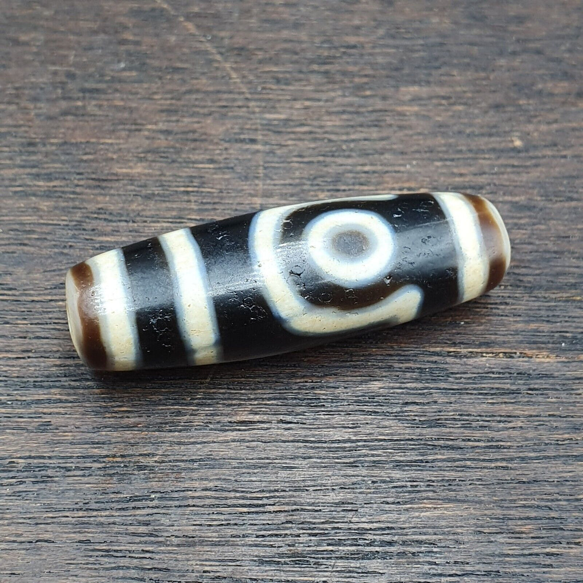 Antique Agate Tibetan Gzi Pendant with Two Eyes - Traditional Old Amulet representing Tibetan culture and spirituality.