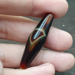 Antique Middle Eastern Red Agate Natural Eye Agate Bead with Unique Pattern - Exquisite Middle Eastern craftsmanship captured in a striking red agate bead displaying a distinct eye pattern, perfect for jewelry enthusiasts.