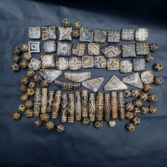 Lot 91 features an exquisite collection of Asian Burmese old Pumtek Palm Wood Stone beads, each carrying a rich history and unique character. Handcrafted with meticulous attention to detail, these beads evoke the artisanal craftsmanship of ancient cultures. Embrace the allure of tradition and authenticity with this captivating assortment, perfect for enhancing any jewelry or craft project with timeless elegance and cultural significance.