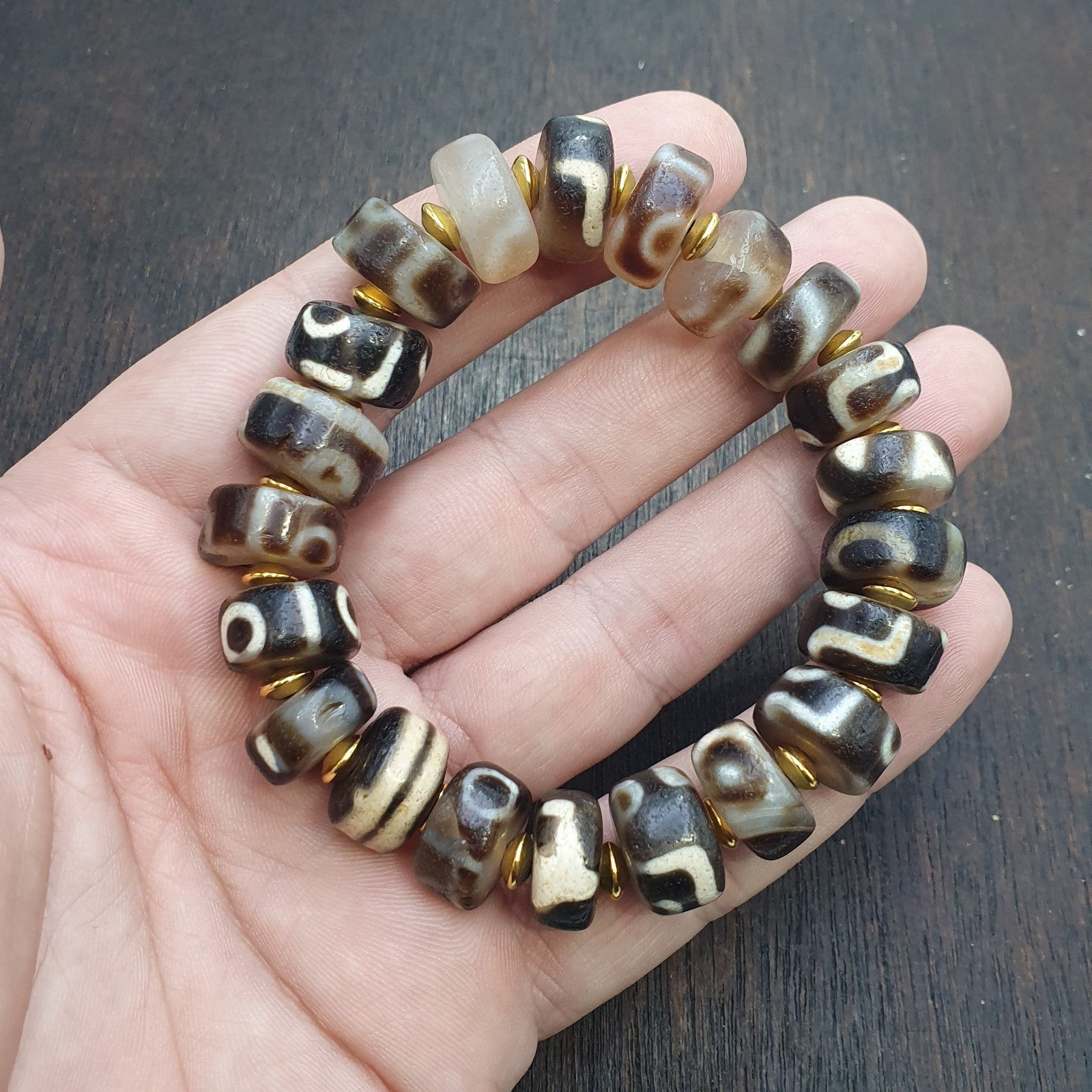 Tibetan nepalese dzi beads bracelet handmade cylindrical beads, gold spacers