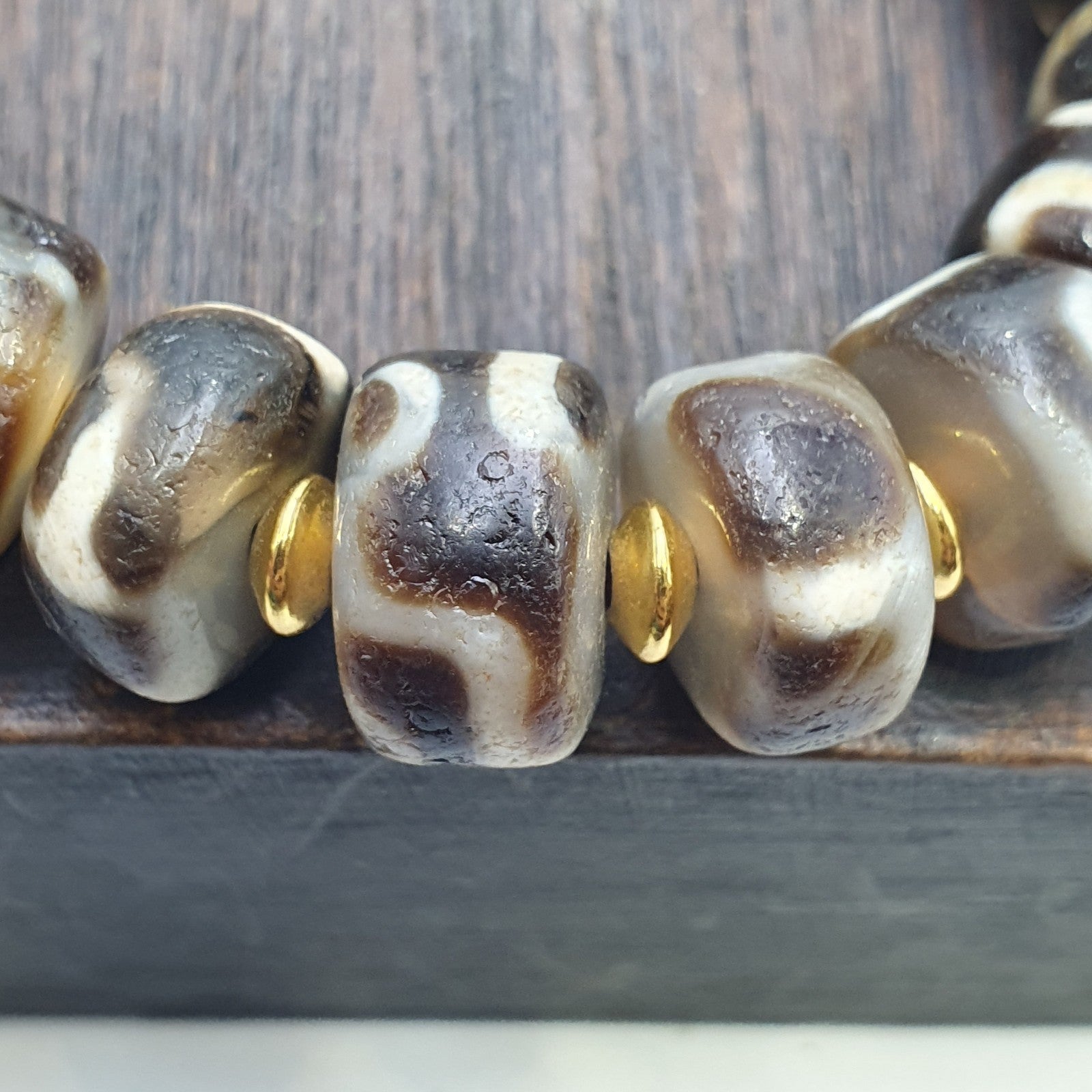 Tibetan nepalese dzi beads bracelet handmade cylindrical beads, gold spacers