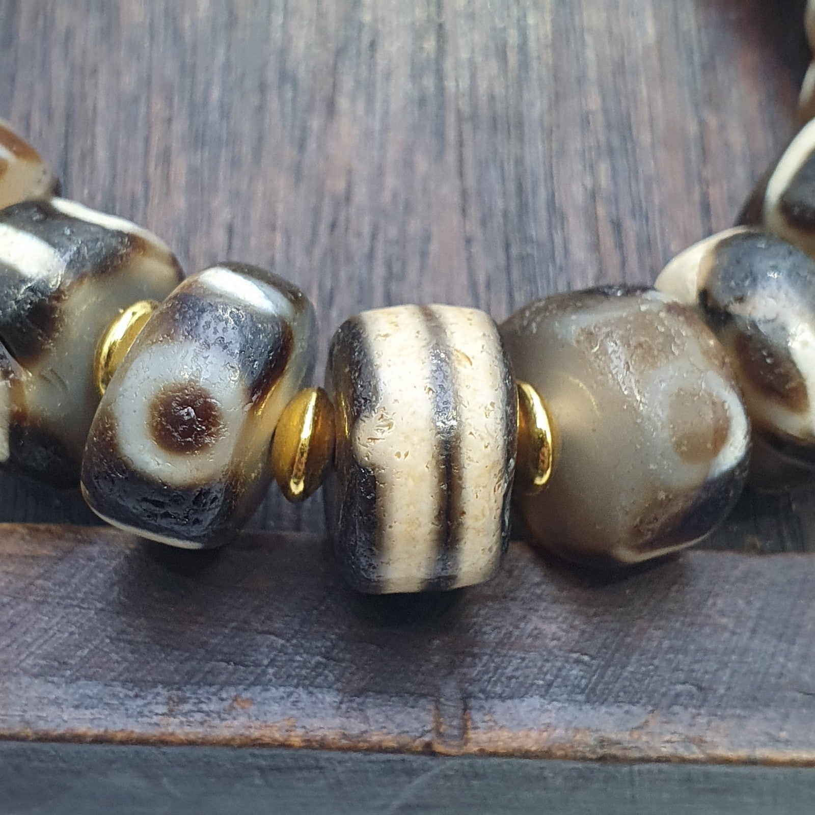 Tibetan nepalese dzi beads bracelet handmade cylindrical beads, gold spacers
