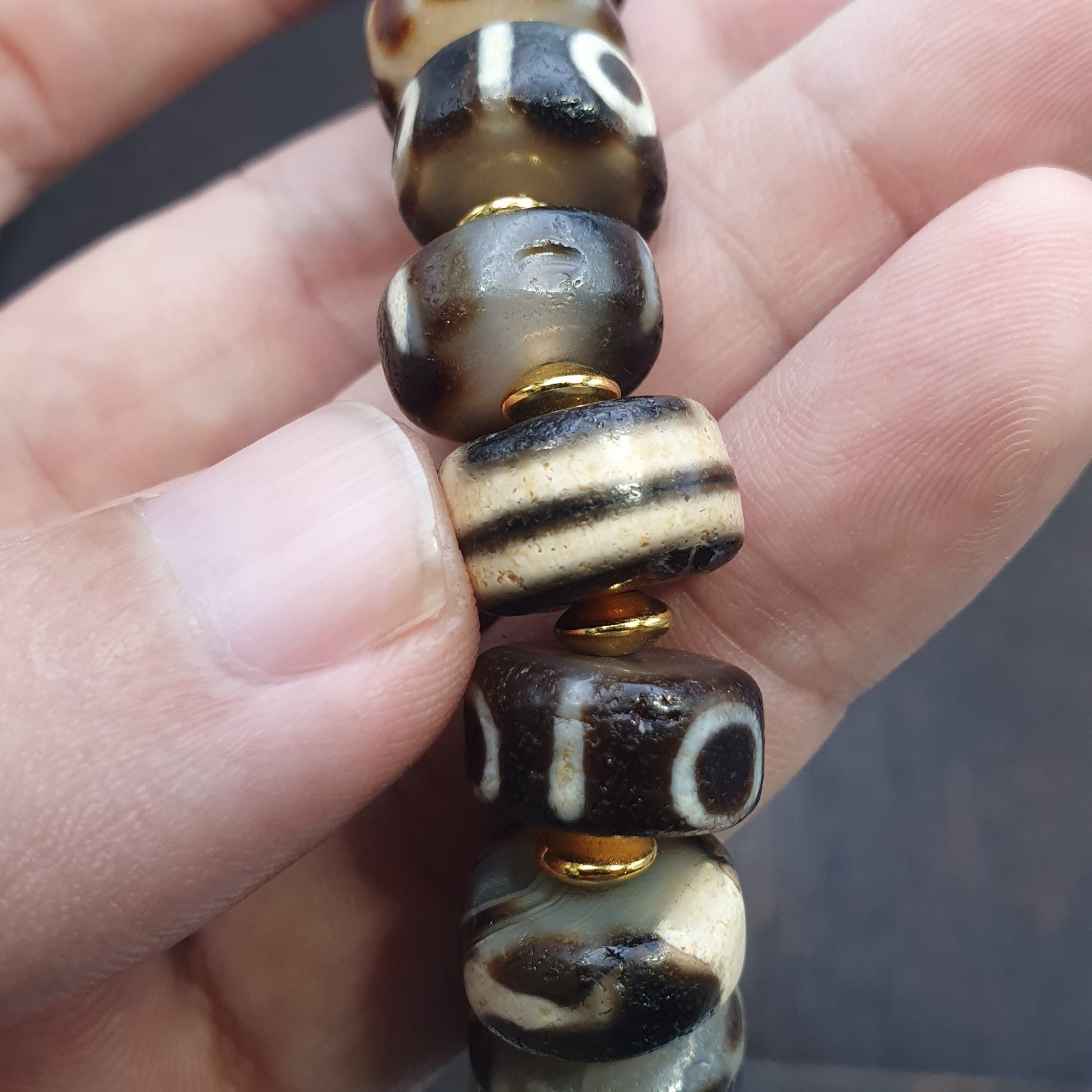 Tibetan nepalese dzi beads bracelet handmade cylindrical beads, gold spacers