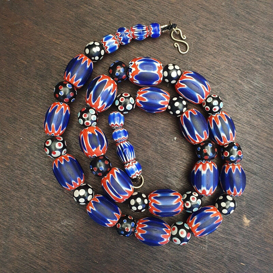 Antique venetian inspired african blue glass chevron and hundred eyes beads.