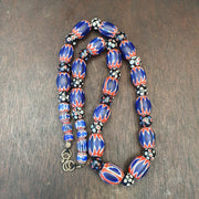Antique venetian inspired african blue glass chevron and hundred eyes beads.