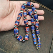 Antique venetian inspired african blue glass chevron and hundred eyes beads.