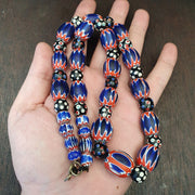 Antique venetian inspired african blue glass chevron and hundred eyes beads.