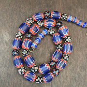 Antique venetian inspired african blue glass chevron and hundred eyes beads.