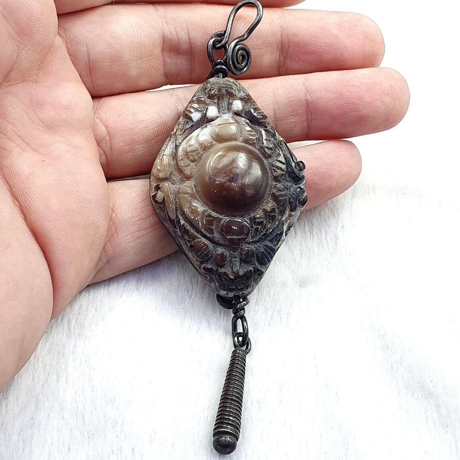 Antique Tibetan carved agate bead pendant set with sterling silver – photo 1 of 5
