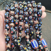 Venetian style beads old chevron skunk dotted eyes glass beads long strand.