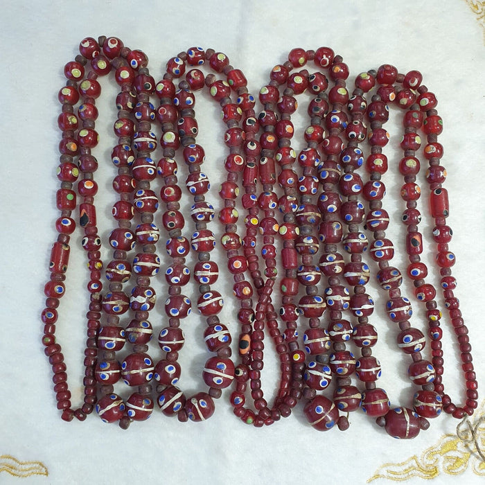 Vintage thousand eyes skunk trade beads blue eye beads long 36 inches necklace