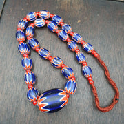 Antique white heart venetian inspired african blue glass chevron with big bead.