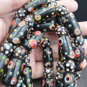 Vintage black gabri eyes skunk thousand eyes glass beads strand.