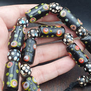 Vintage black gabri eyes skunk thousand eyes glass beads strand.