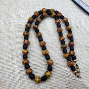 Vintage black yellow, green gabri eyes glass beads strand necklace.