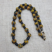 Gbr-2. vintage black yellow, green gabri eyes glass beads strand necklace.