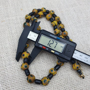Gbr-2. vintage black yellow, green gabri eyes glass beads strand necklace.