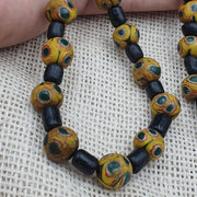 Gbr-2. vintage black yellow, green gabri eyes glass beads strand necklace.