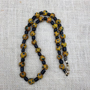 Gbr-2. vintage black yellow, green gabri eyes glass beads strand necklace.