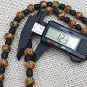 Vintage black yellow, green gabri eyes glass beads strand necklace.