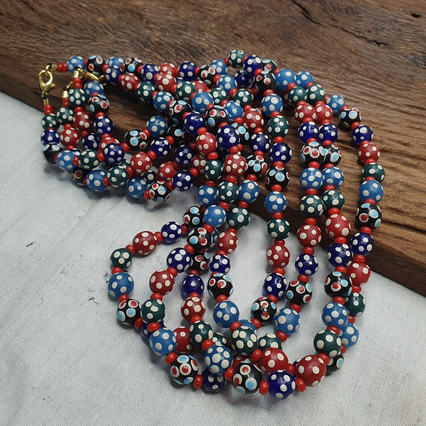 Venetian red whiteheart and venetian inspired multicolor skunk beads necklace