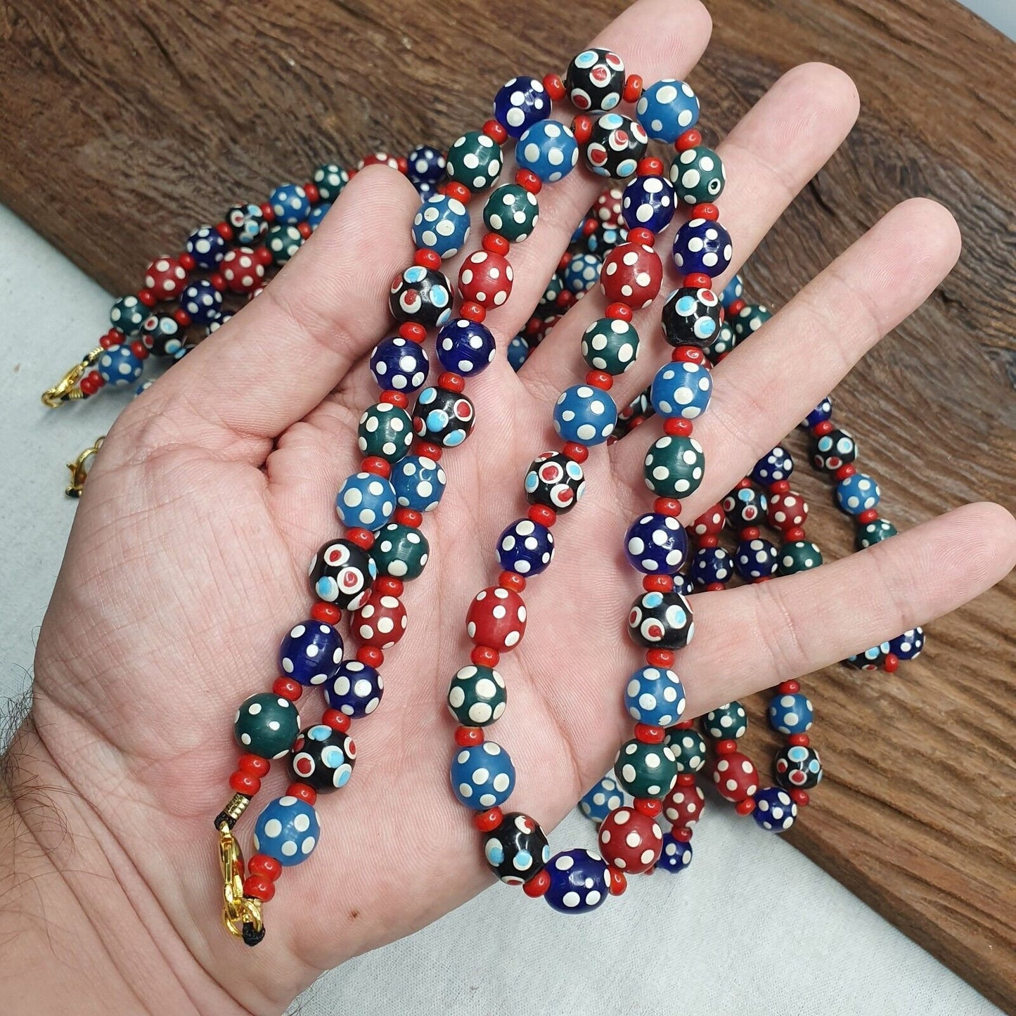 Venetian red whiteheart and venetian inspired multicolor skunk beads necklace