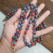 Venetian red whiteheart and venetian inspired multicolor skunk beads necklace
