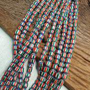 Vintage venetian style  african blue red glass chevron beads long strand.