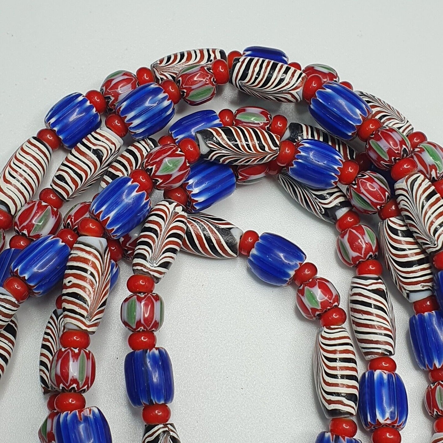 White heart with venetian style chevron, feather beads necklace.