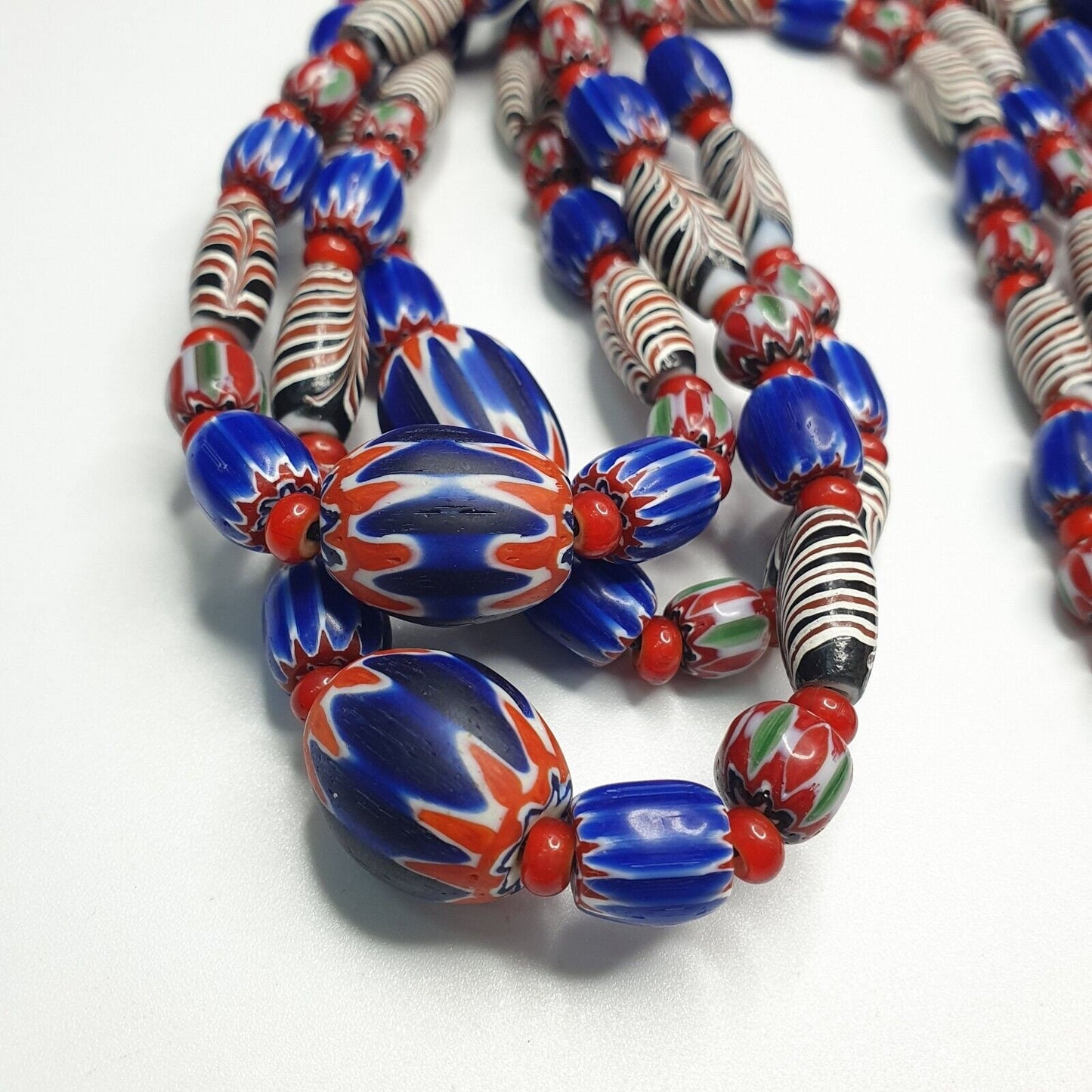 White heart with venetian style chevron, feather beads necklace.