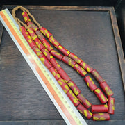 Vintage red tube fancy glass beads necklace.
