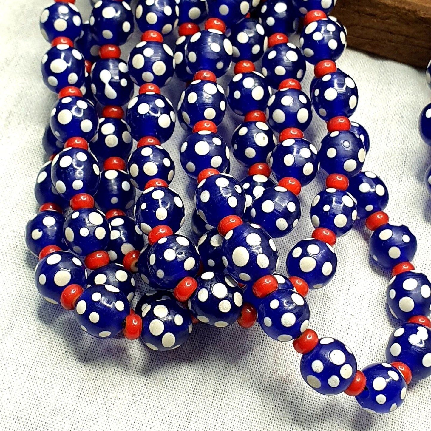 Venetian red whiteheart and venetian inspired blue skunk glass beads necklace