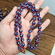 Venetian red whiteheart and venetian inspired blue skunk glass beads necklace