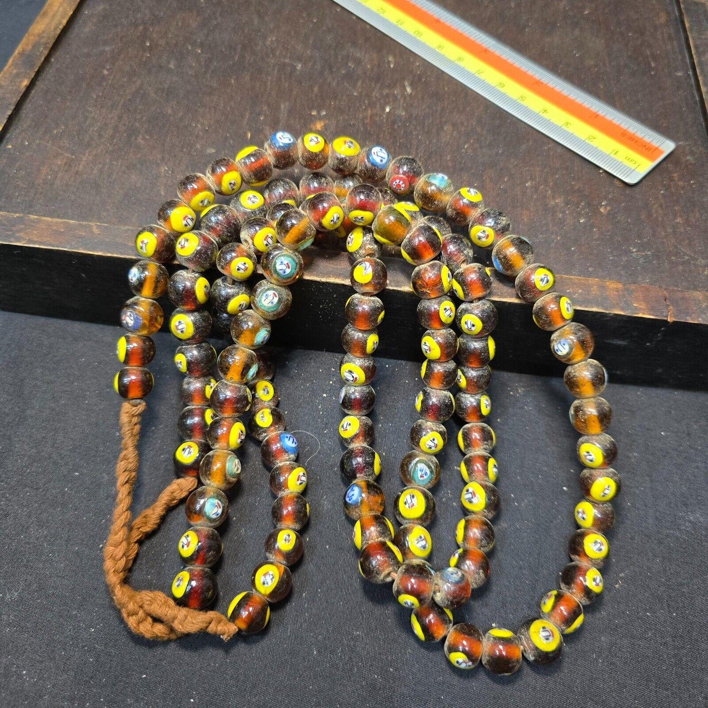 Brown tint small yellow smiley faces venetian inspired beads strand