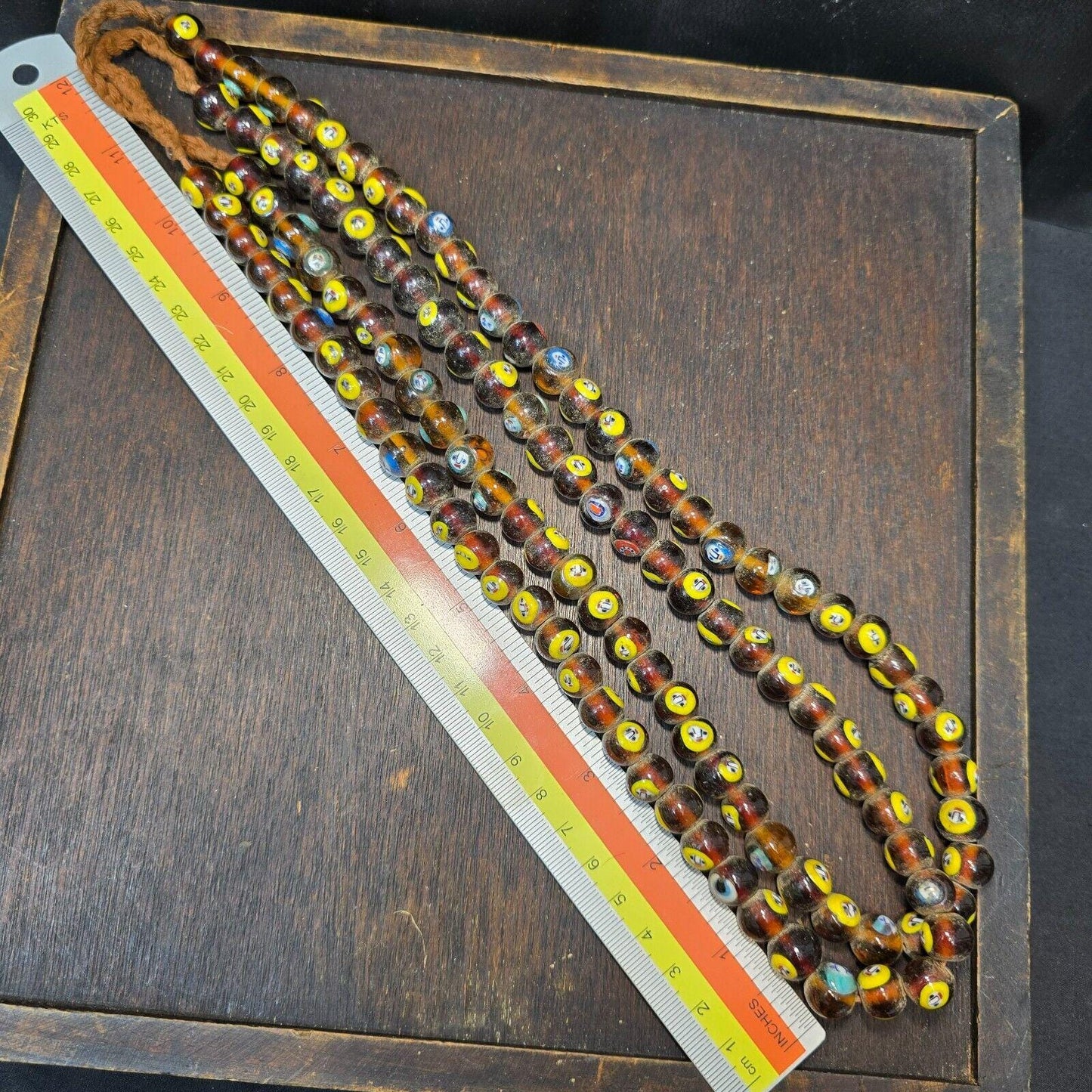 Brown tint small yellow smiley faces venetian inspired beads strand