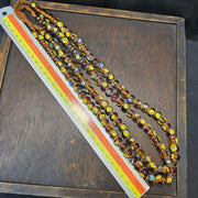 Brown tint small yellow smiley faces venetian inspired beads strand