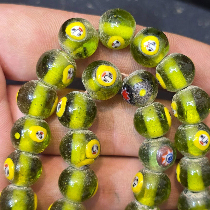 Greenish tint small yellow smiley faces venetian inspired beads strand