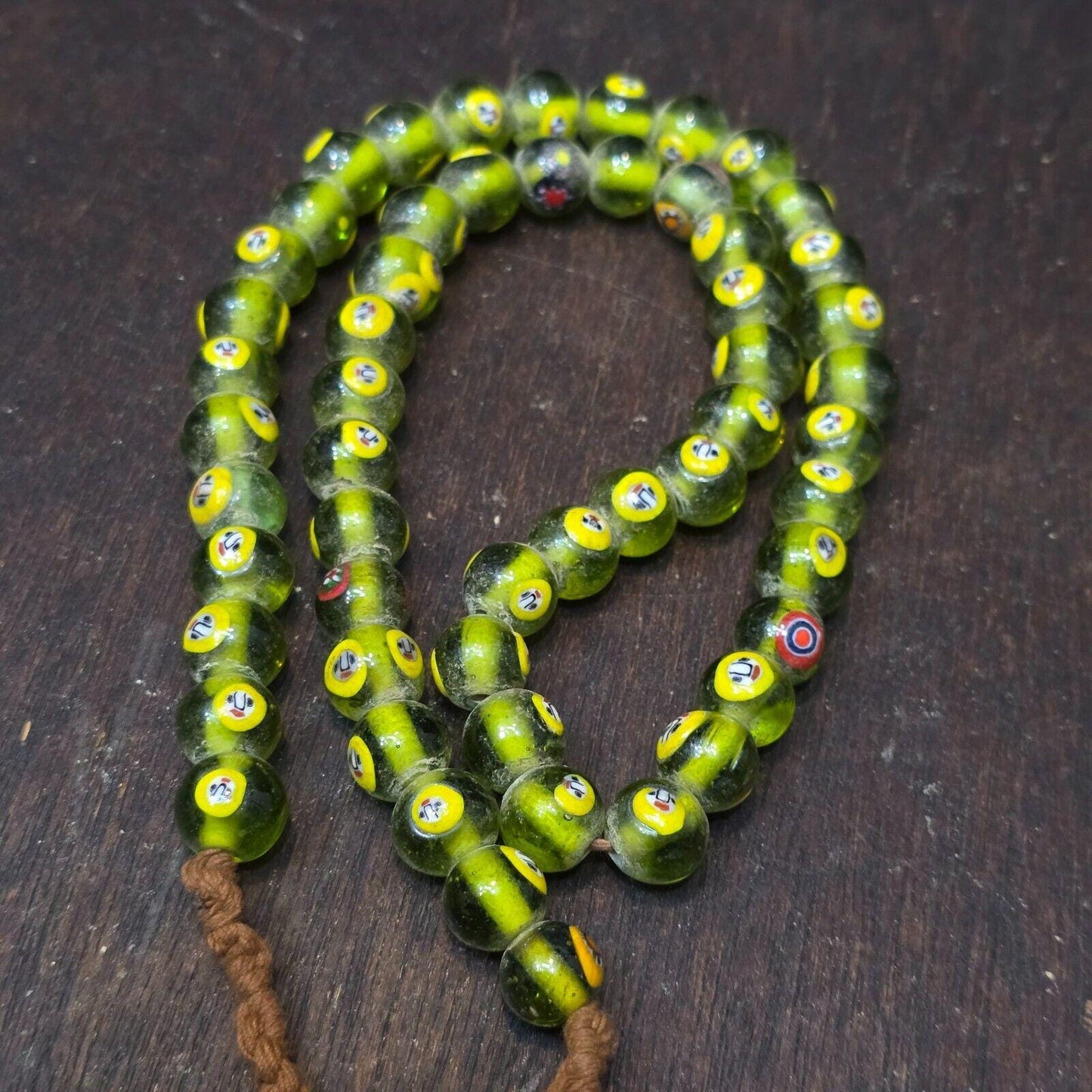 Greenish tint small yellow smiley faces venetian inspired beads strand