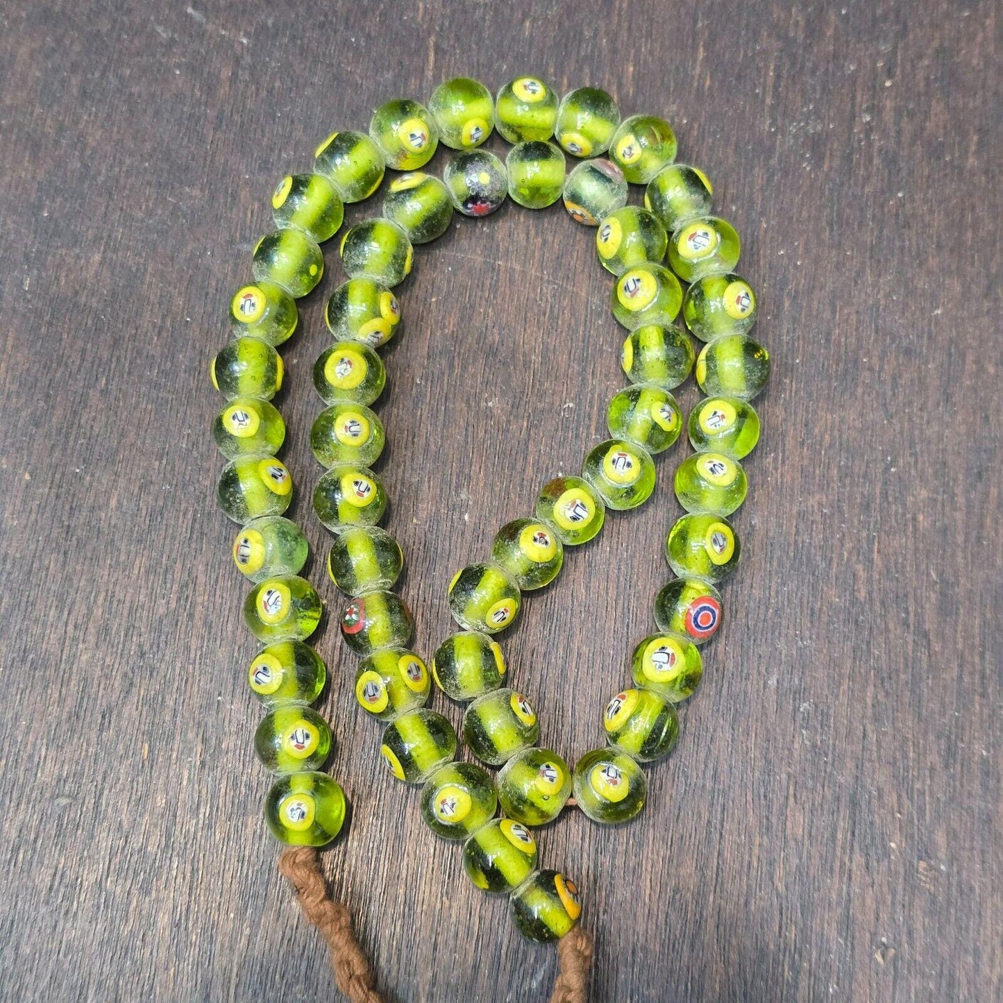 Greenish tint small yellow smiley faces venetian inspired beads strand