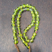 Greenish tint small yellow smiley faces venetian inspired beads strand